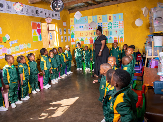Teacher leading a classroom activity with children